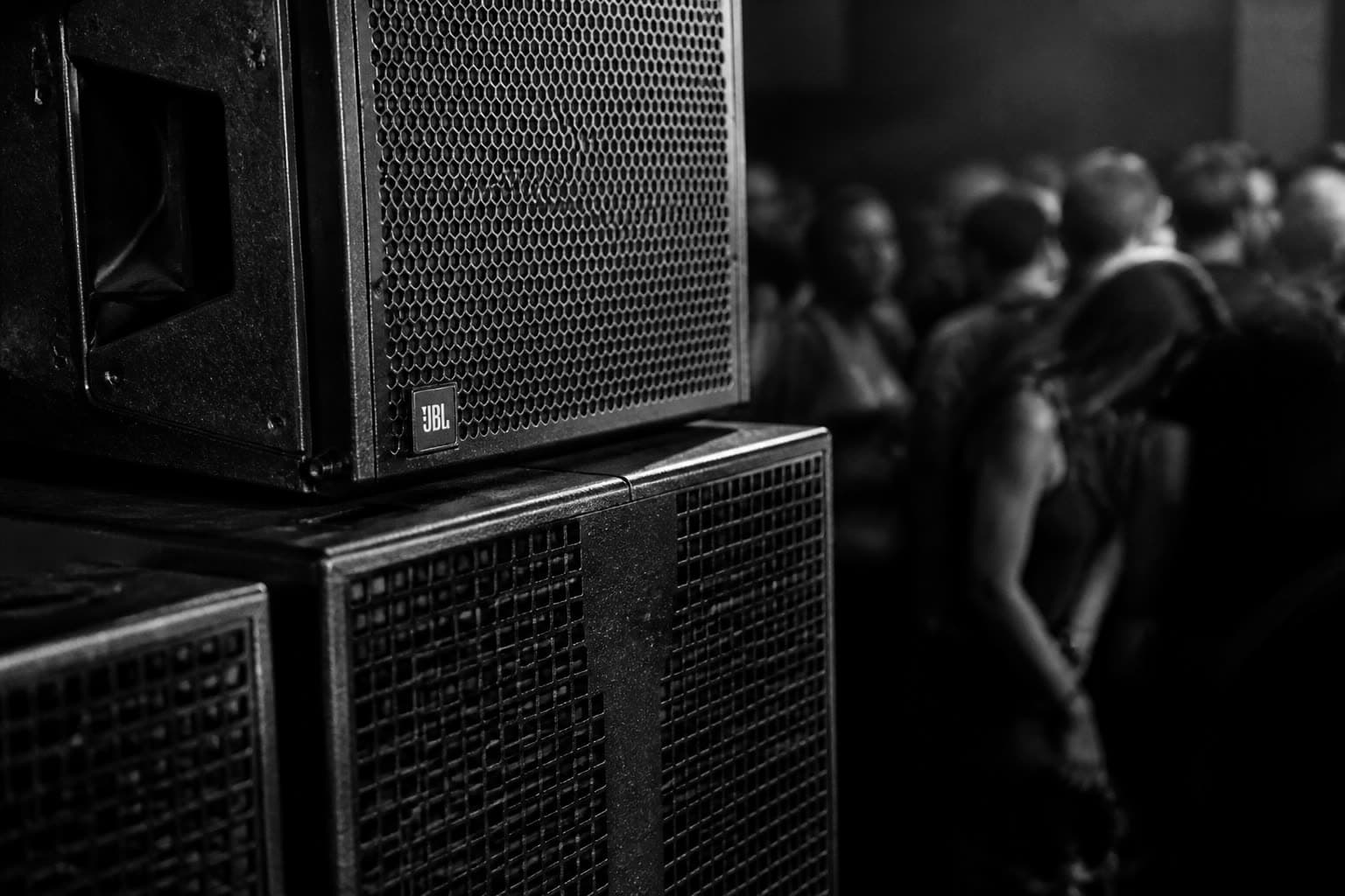 Club speaker stacks in darkness